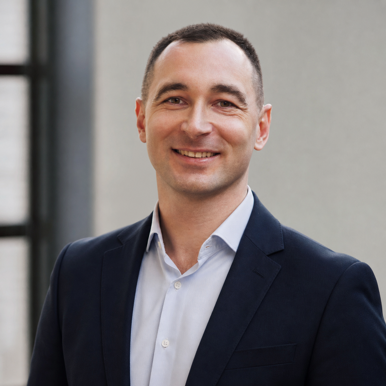 Artur Kvade wearing a navy blazer